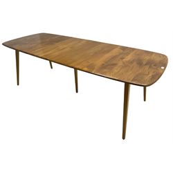 Ercol - light elm and beech 'Slide Leg Expanding Dining Table (444)', rectangular top with rounded corners, raised on tapered splayed supports, with two additional leaves