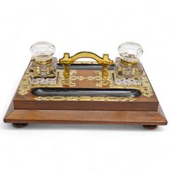 Victorian brass mounted twin inkstand, upon bun feet complete with two glass ink bottles w...