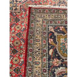 Perisian Bidjar crimson ground rug, within scalloped borders, central pole medallion, the field decorated all over with floral Herati motifs, guarded border decorated with repeating stylised plant motifs and trailing branch 