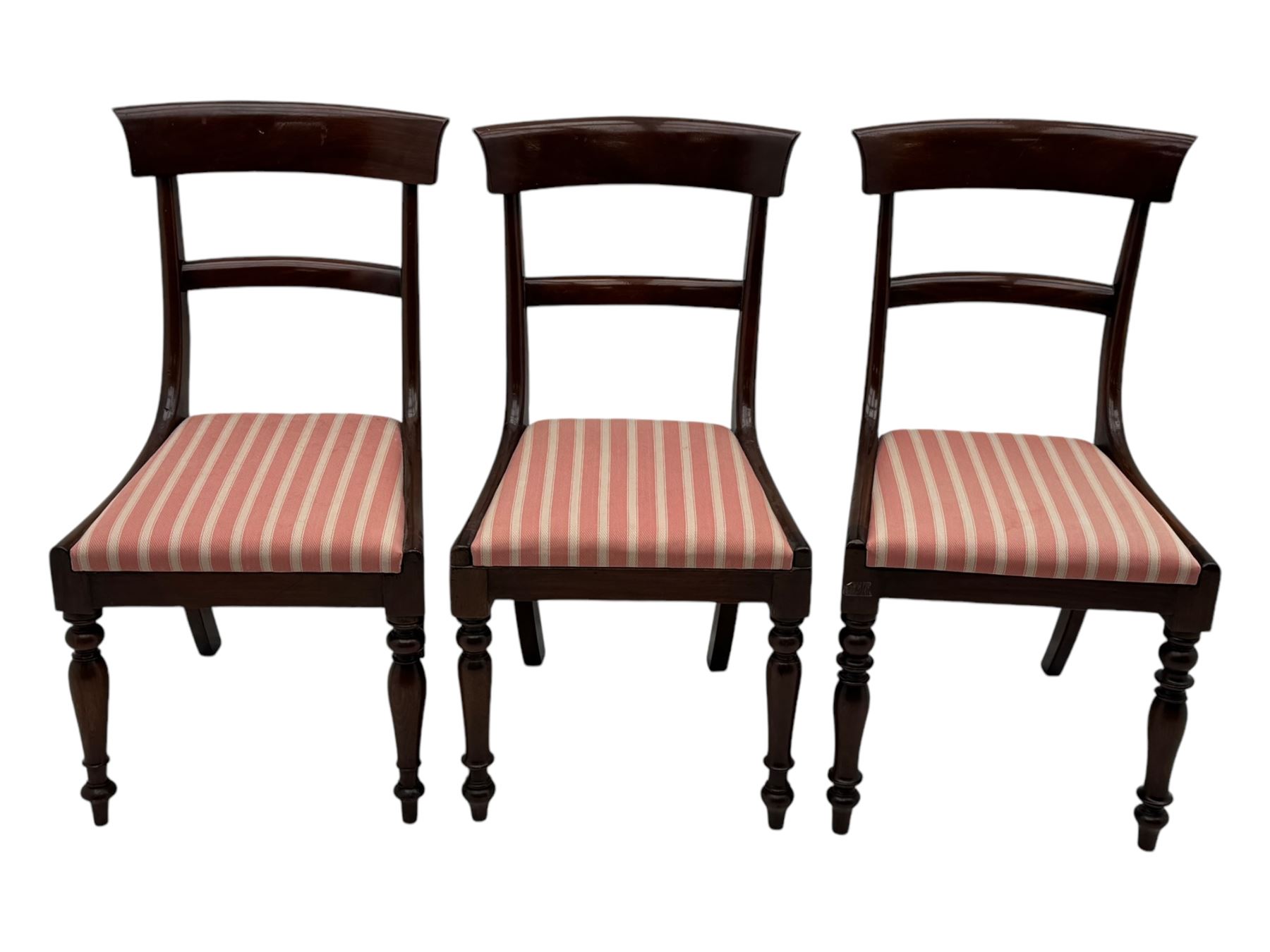 Set of six Victorian mahogany dining chairs, curved bar back over drop-in seat upholstered in striped fabric, on turned front supports