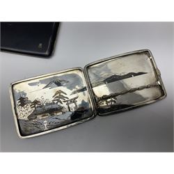 Japanese silver cigarette case, and another gold plated example, both depicting a mountain scape, together with a cloisonne matchbox holder 