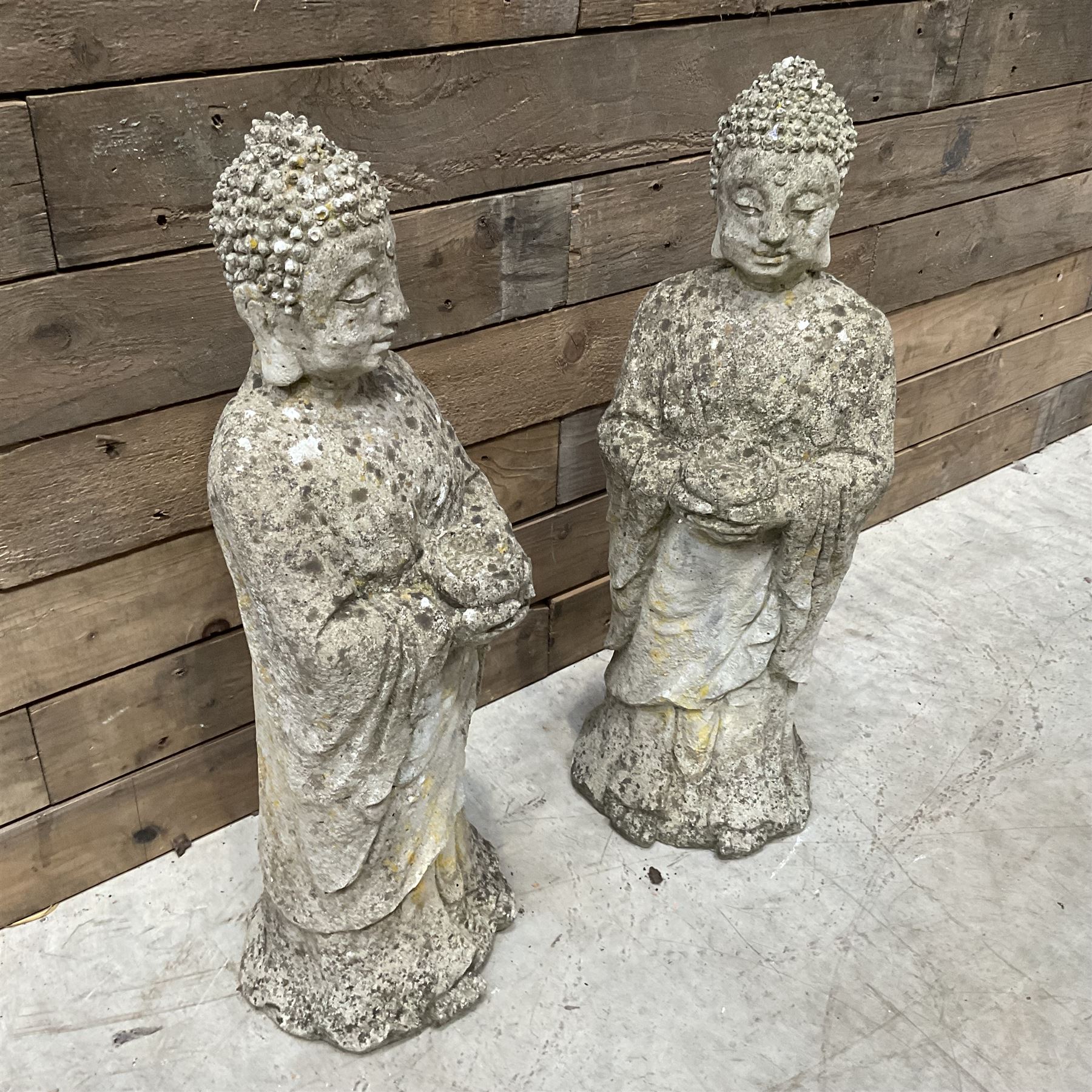 Pair of cast stone garden Buddahs