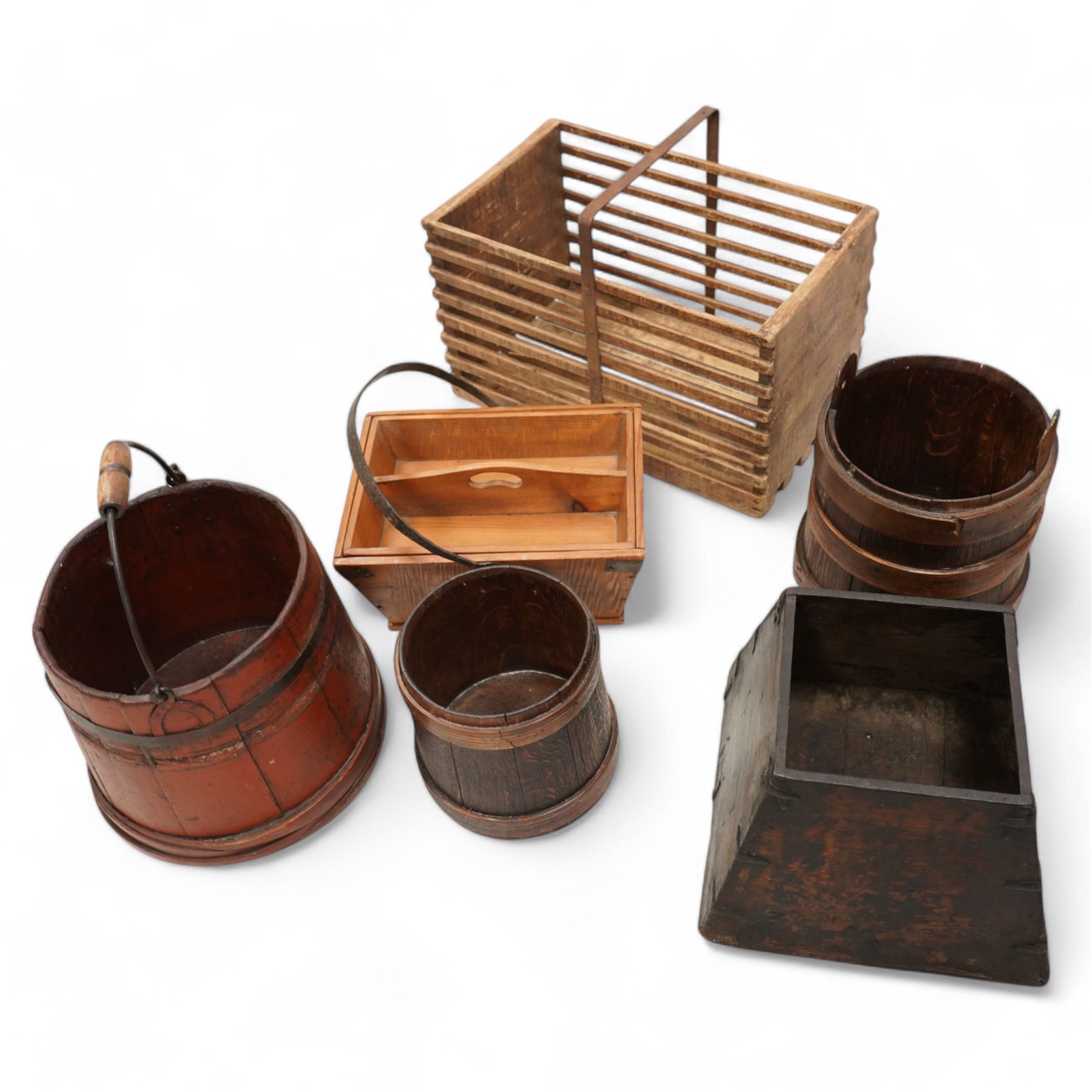 19th century pine and metal bound dome top trunk (W61cm); four 19th century grain bushels; pine cutlery basket with wrought iron handle; rectangular wooden crate with carry handle; egg stand with a timer converted from a large bobbin (8)  