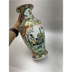 Pair of Famille Rose vases of baluster form, decorated with panels depicting musicians, H30cm