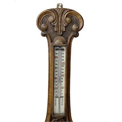 Edwardian - carved oak aneroid barometer, with a rounded top carved with scroll work, 8