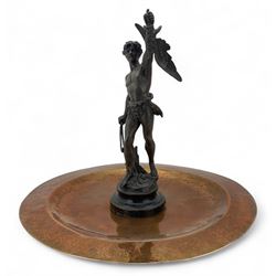 19th century French spelter figure 'Chasseur D'Aigles' on wooden base H48cm and a beaten copper circular tray inscribed with initials D61cm