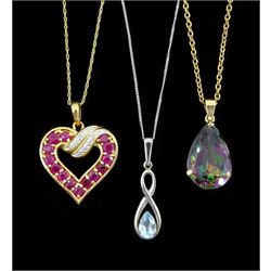 White gold single stone blue topaz pendant necklace, ruby and diamond pendant necklace and a gold mystic topaz pendant, all 9ct, on a gilt chain