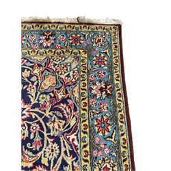 Persian indigo ground rug, overall arabesque design, central multi-point medallion surrounded by scrolling leafy branches and palmettes, the border decorated with repeating stylised plant motifs within guard stripes 