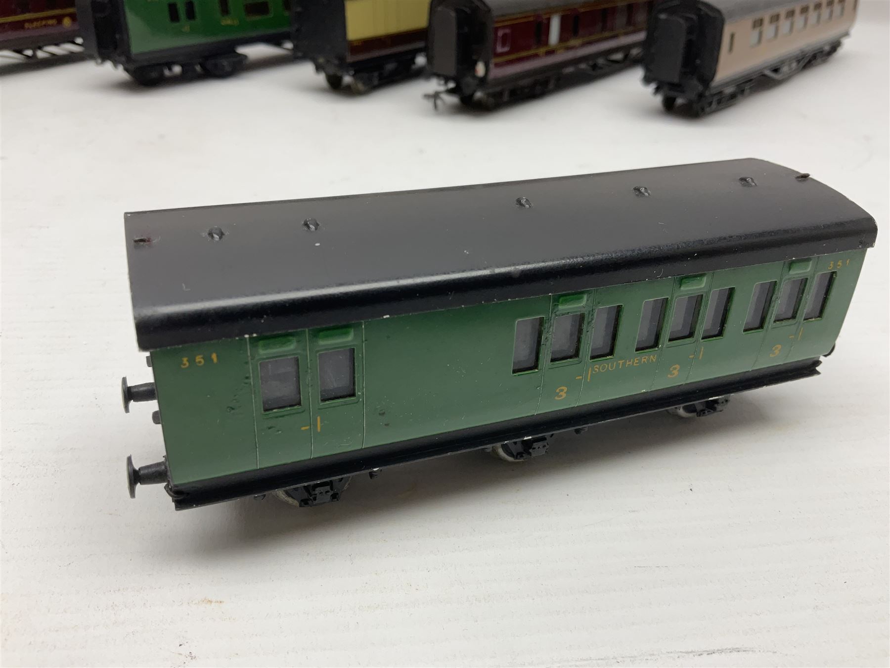 Exley '00' gauge - fourteen various coaches comprising four LMS maroon (3322 3rd, 2202 3rd, 6665 3rd and 388 Sleeping Car 3rd), LNER green/cream Buffet Car 21419, LNER teak 8639 1st, Southern green 6688 3rd, GWR brown/cream 3322 3rd, LNER 206 3rd, LNER 319 1st/3rd, SR green 351 3rd, SR green 188 Parcel Van, GWR 331 3rd and GWR 362 3rd; all unboxed (14)