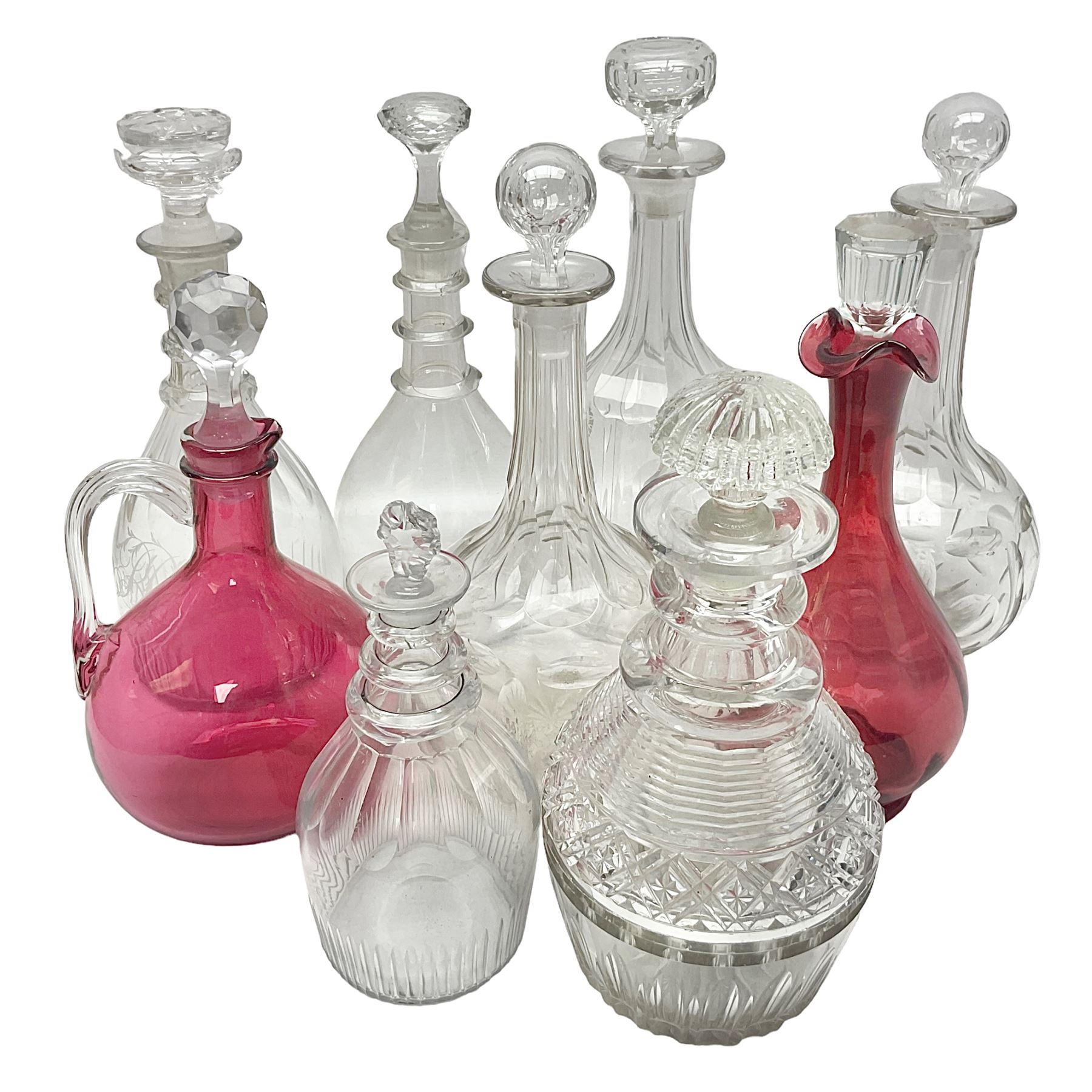 Collection of Victorian and later decanters, to include cut glass and cranberry glass example, and a cranberry glass jug with stopper