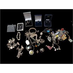 Large collection of silver jewellery, including brooches, earrings, necklaces, charm brace...