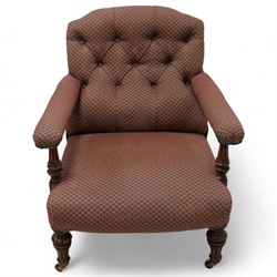 Late 19th century drawing room walnut framed open armchair, arched back over fluted and turned arm terminals and deep sprung seat, upholstered in buttoned maroon patterned fabric with stud detail on turned and fluted supports with castors