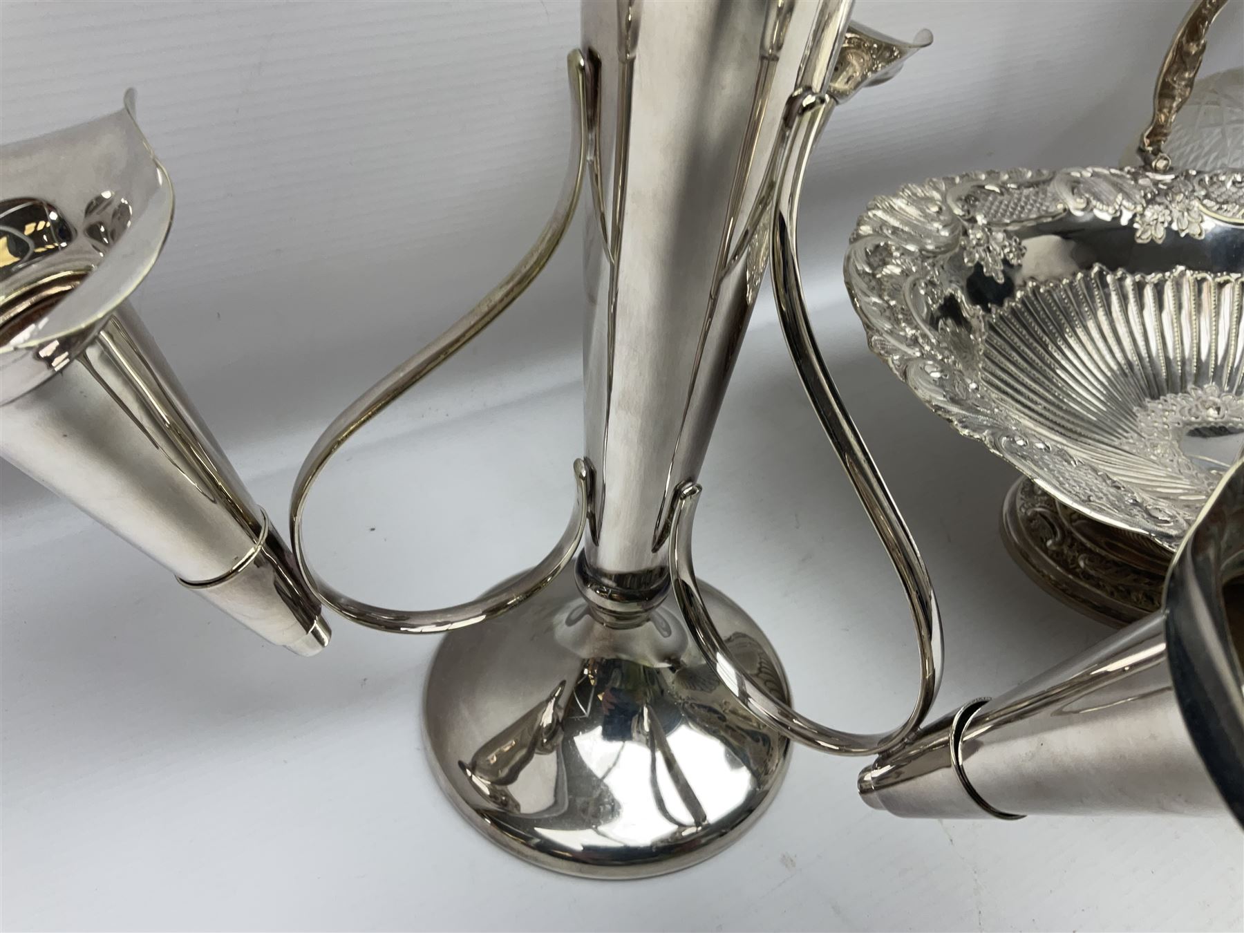 Silver plated three branch epergne, together with a silver plated cut glass claret jug, and silver plated embossed swing handled basket, epergne H30.5cm