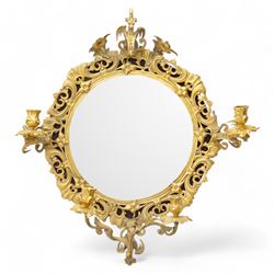 Early 20th century gilt brass wall mirror, circular bevelled mirror plate enclosed by scro...