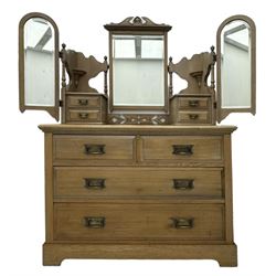 Late Victorian satin walnut dressing table, central mirror with carved crest flanked by two adjustable side mirrors, each supported by turned uprights, the base fitted with two short over two long drawers with brass handles, resting on bracket feet