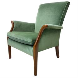 Parker Knoll - mid 20th century green velvet upholstered armchair, high back and cushioned seat, curved wooden armrests, on tapered supports