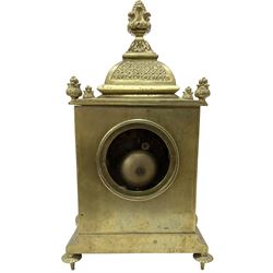 French - Brass cased 8-day mantle clock c1880, with a domed top surmounted by a pineapple finial, four reeded pilasters to the corners and raised on tapered feet, with a conforming dial with cartouche numerals, fleur-di -Lis hands and the name, Phillippe, 66 Palais Royal, Paris, twin train countwheel striking movement sounding the hours and half-hours on a bell.  With pendulum and key. 
