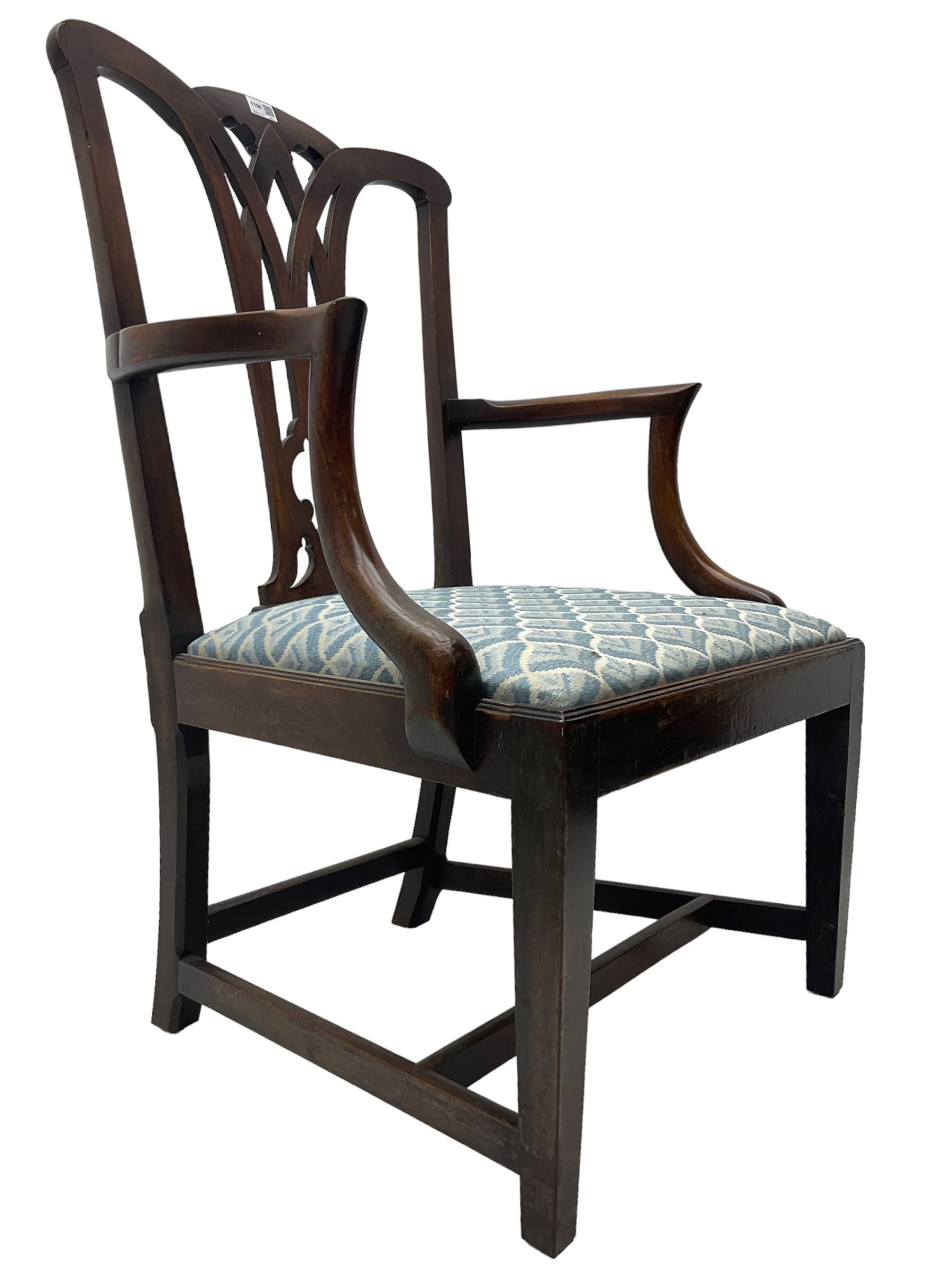 Set of eight (6+2) George III mahogany dining chairs, yoke cresting rail over shaped pierced splat back, drop in seats upholstered in pale blue patterned fabric, raised on square chamfered supports united by stretchers