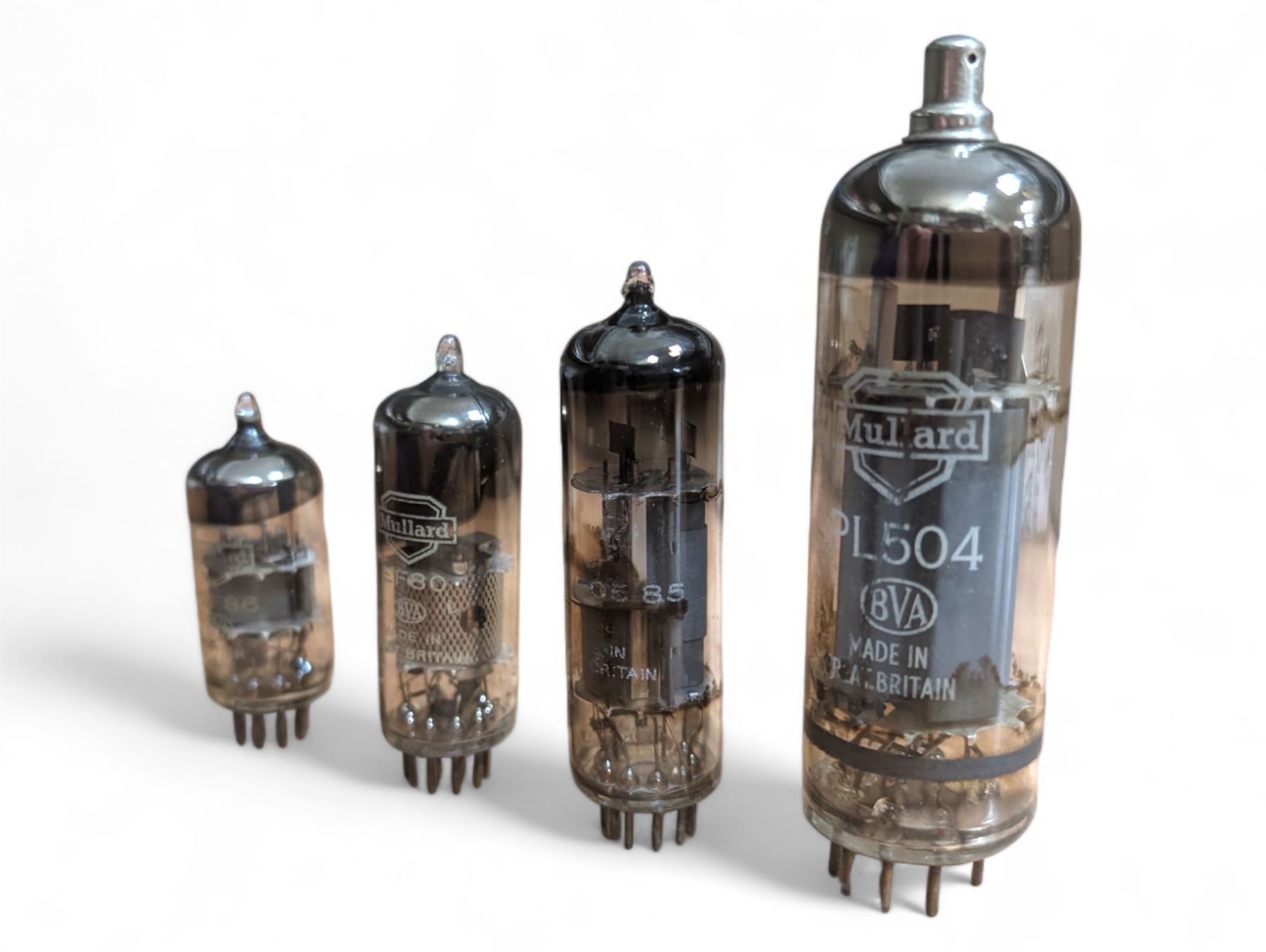 Collection of Mullard thermionic radio valves/vacuum tubes, mostly bubble wrapped and identified with lists