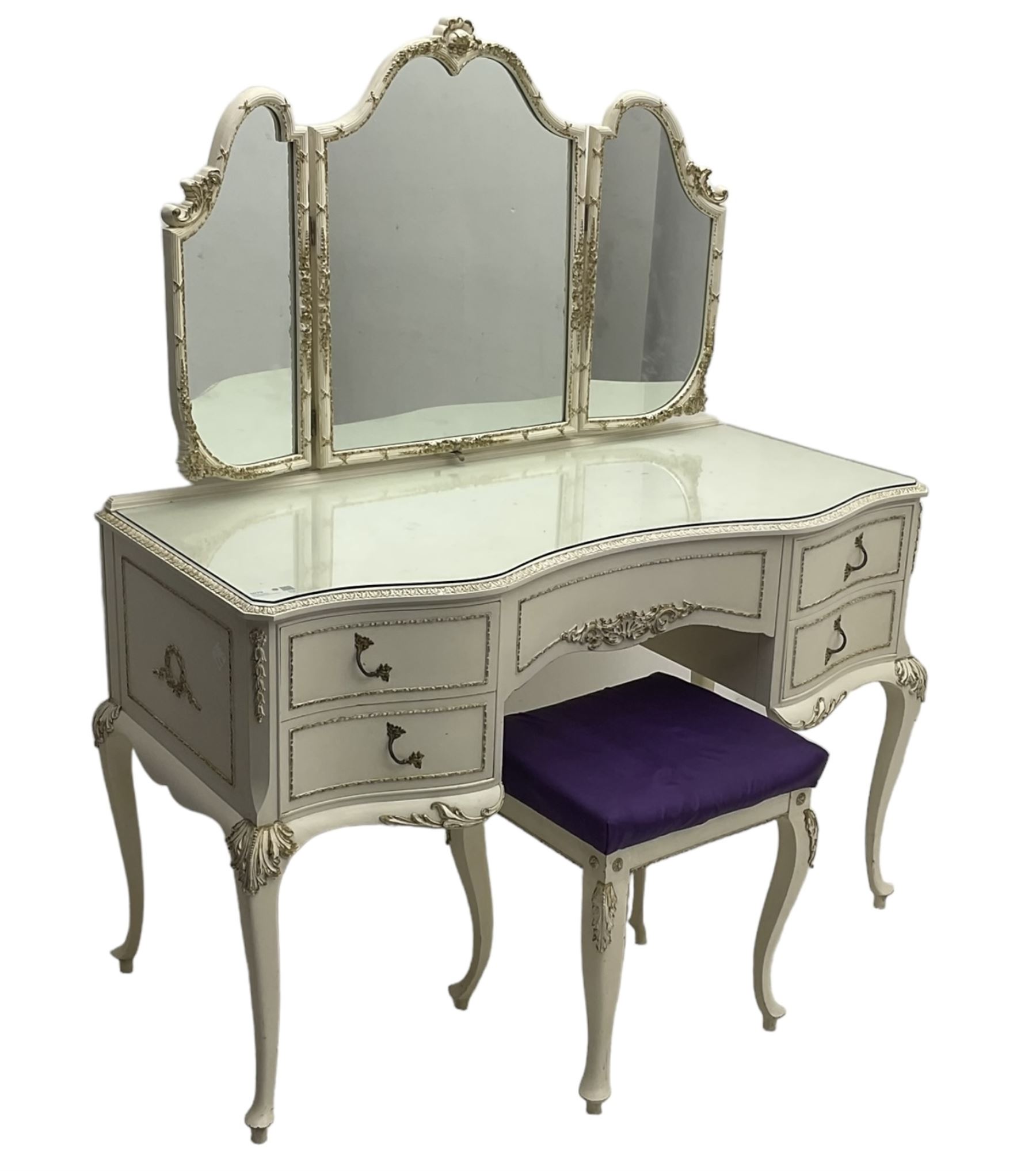 Mid 20th century French style dressing table, triple mirror back and serpentine front with gilt moulded edges, over five drawers with floral and foliate motifs, on cabriole supports; matching stool (2)