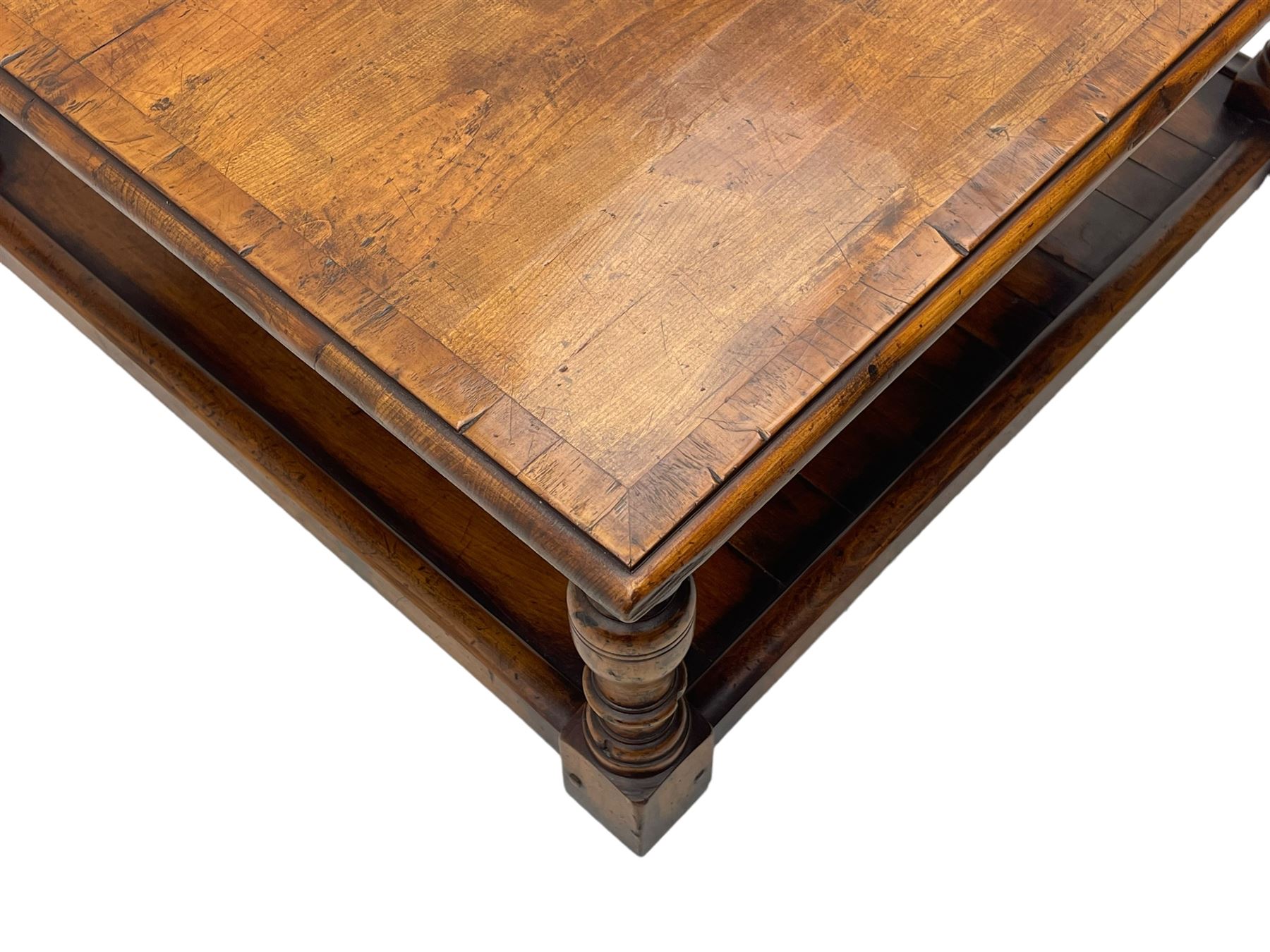 Square elm coffee table, square ovolo-moulded top with fruitwood band, turned supports united by undertier 