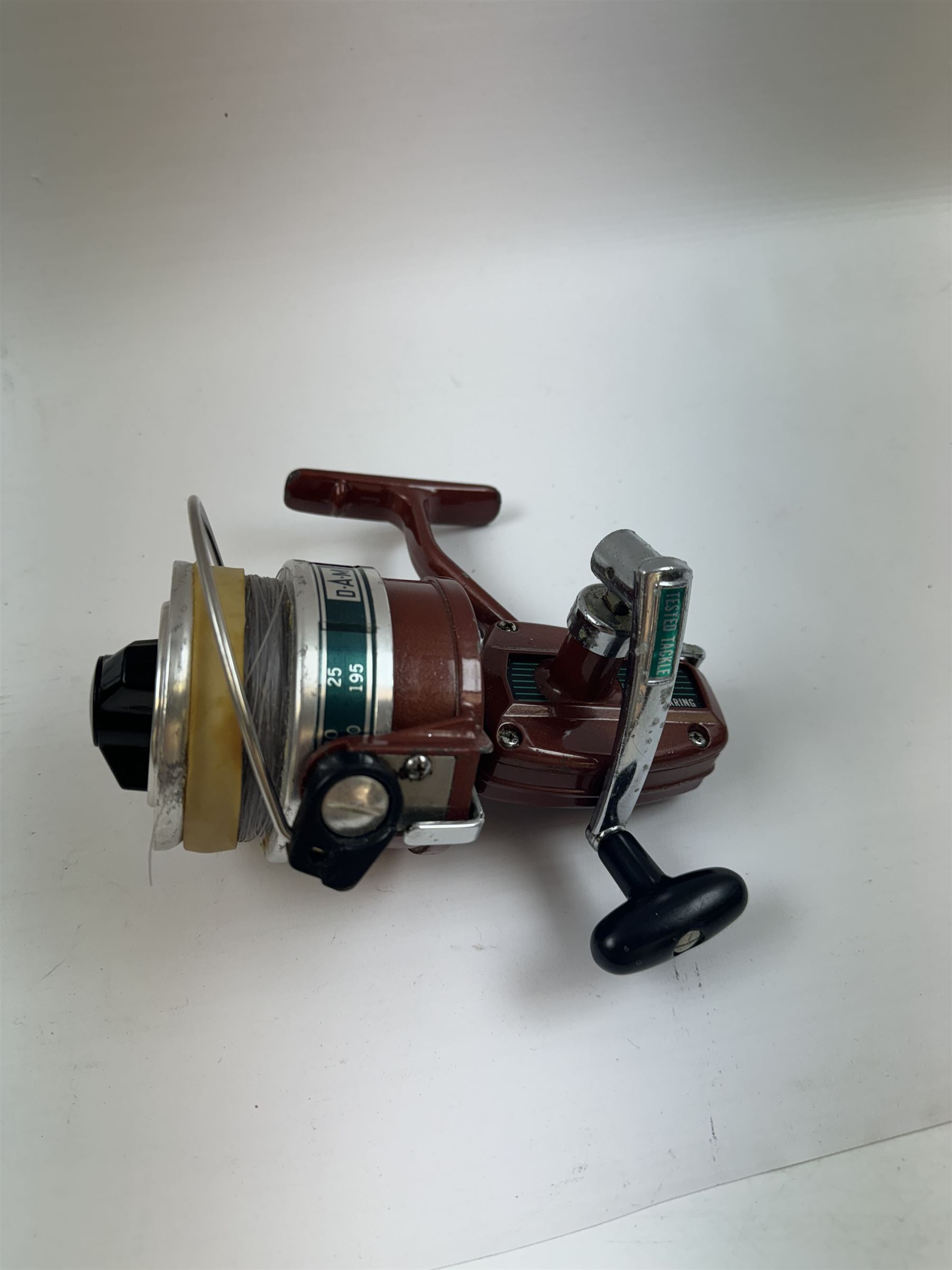 Four fishing reels, Winfield Beach fisher rod, Winfield International 20 , DAM International etc 