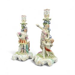 Pair of Derby figural candlesticks, modelled as Venus & Cupid and Mars, Mars wears armour with a shield to his right, Venus dressed in a robe with floral decoration and Cupid by her side, both with pierced sconces above bocage stems, on scrolling raised bases, unmarked, H27cm max (2)