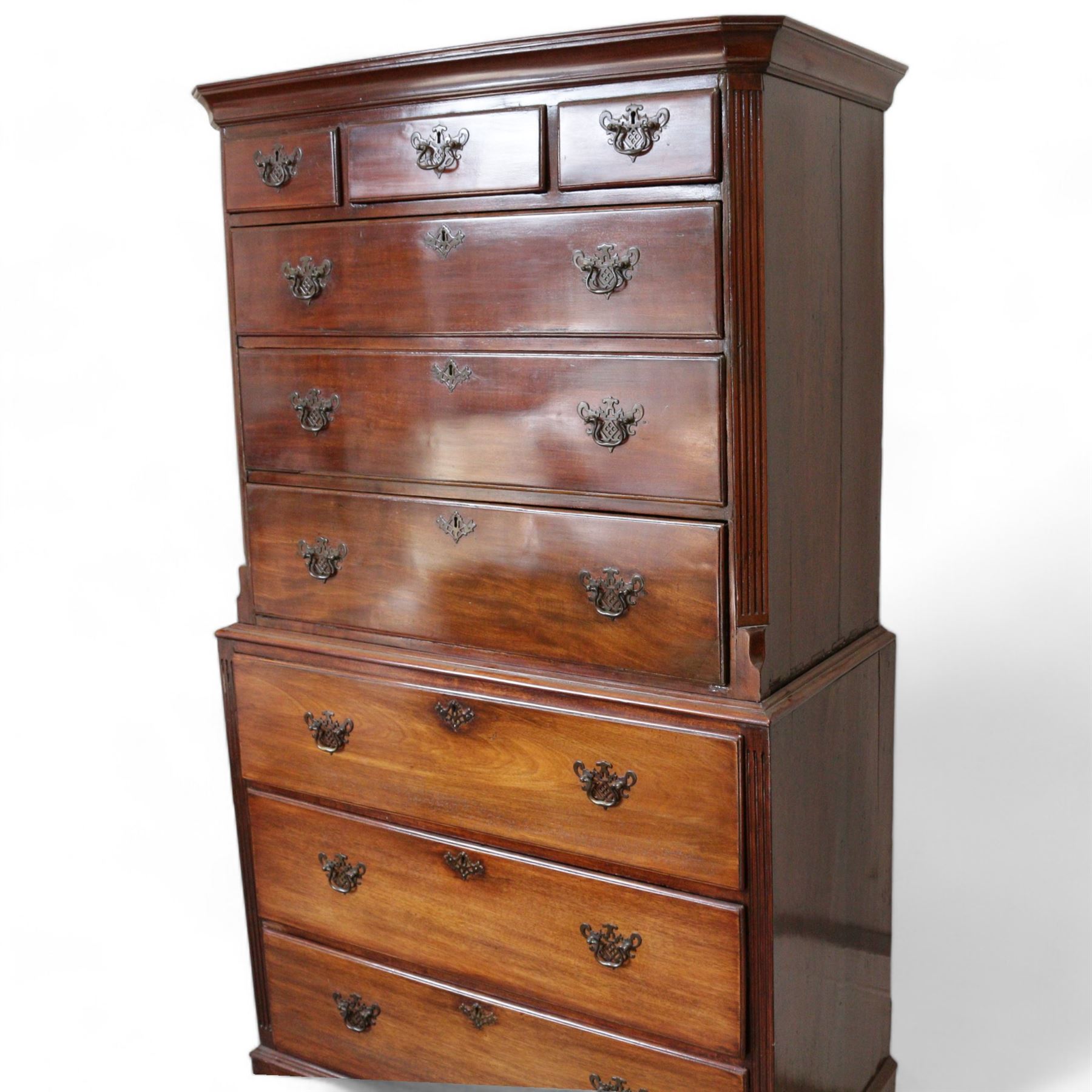 George III mahogany chest-on-chest, projecting moulded cornice, fitted with three short over six long graduating drawers, on bracket feet