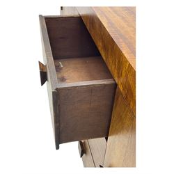 Contemporary Dakota mango wood sideboard, plain rectangular top over three central drawers flanked by cupboards with shelving, each with square pulls, raised on stile supports