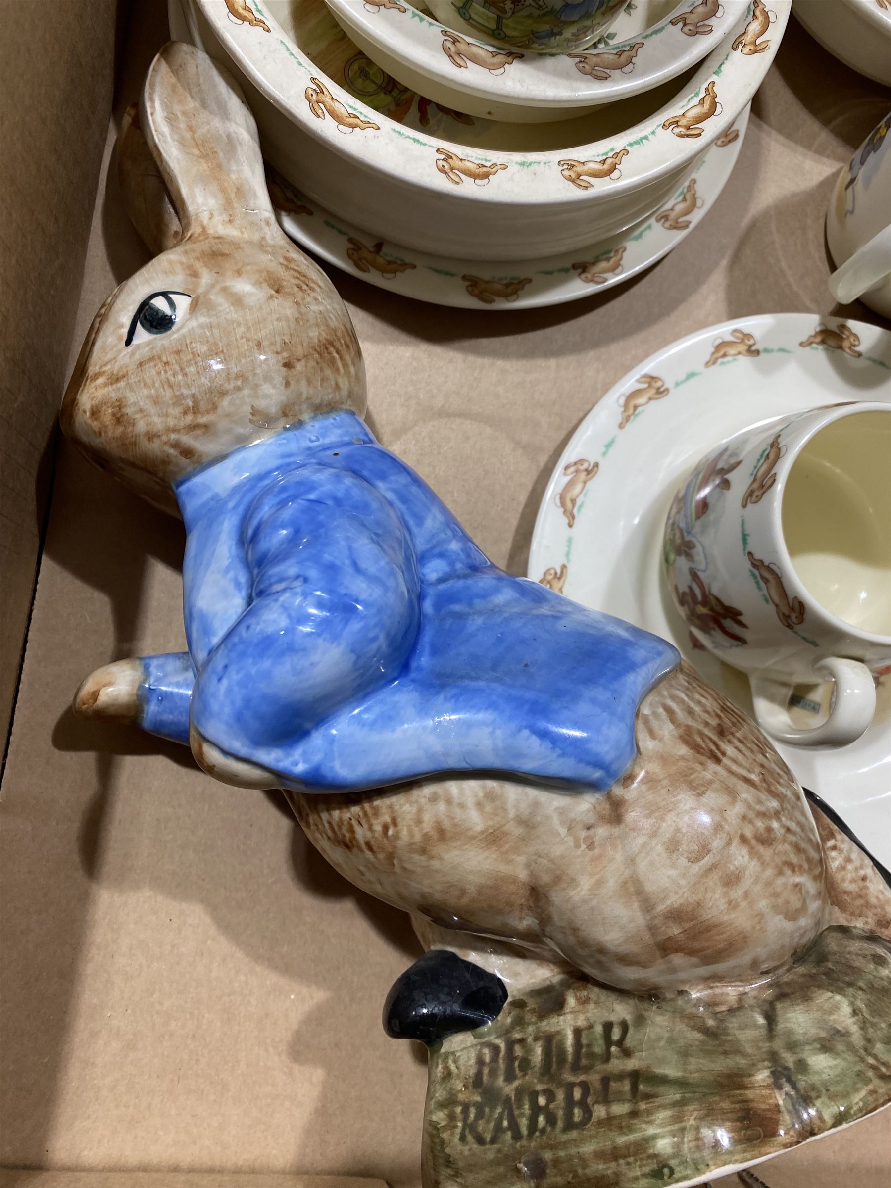 Collection of Royal Doulton Bunnykins nursery ware, together with a Sylvac Peter Rabbit figure