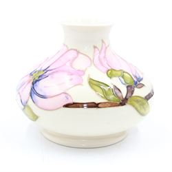 Moorcroft squat vase, in Hibiscus pattern on a white ground, H13cm 