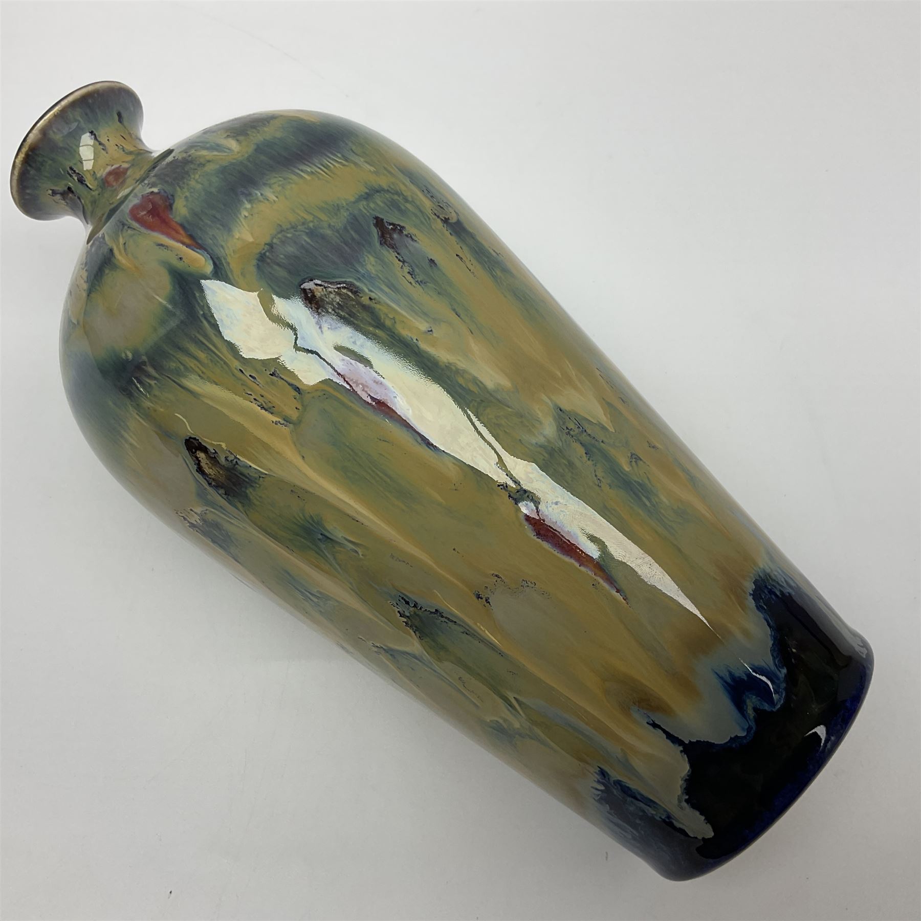 Cobridge Stoneware vase of bluster form by Andrew Hill, decorated in layered dripping blue red and brown glaze, with impressed and painted mark beneath 