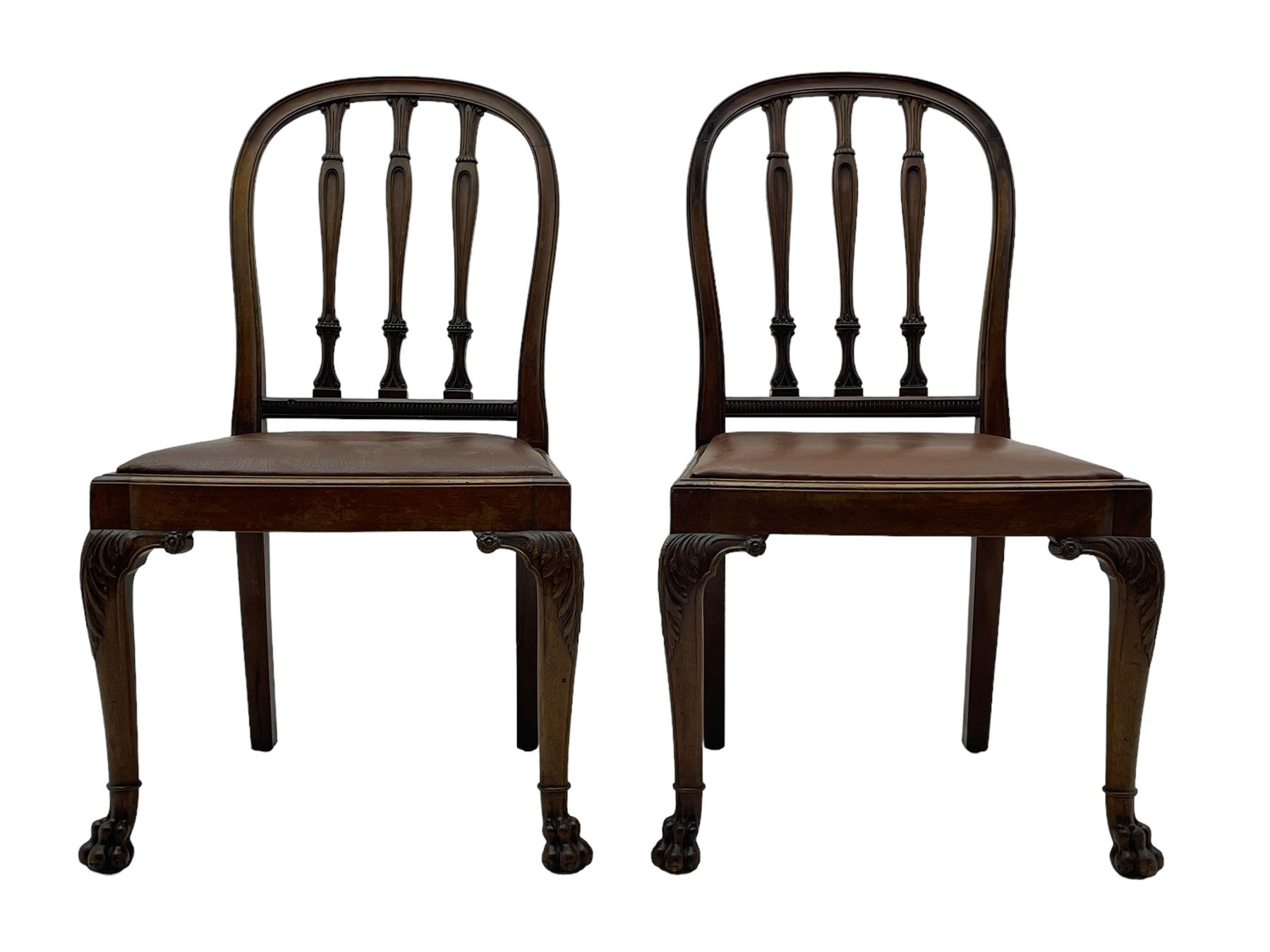 Set of six early 20th century Hepplewhite design mahogany dining chairs, moulded arched frame back, three shaped vertical rails carved with stylised foliate decoration, drop-in seats upholstered in brown fabric within moulded seat rails, on acanthus leaf carved cabriole supports with paw carved terminals 