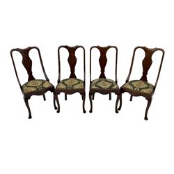 Set of eight late 19th century mahogany spoon back dining chairs, each with shaped top rail over Queen Anne design vase-shaped splat, upholstered seats in floral patterned fabric, raised on cabriole supports with scroll carved knees