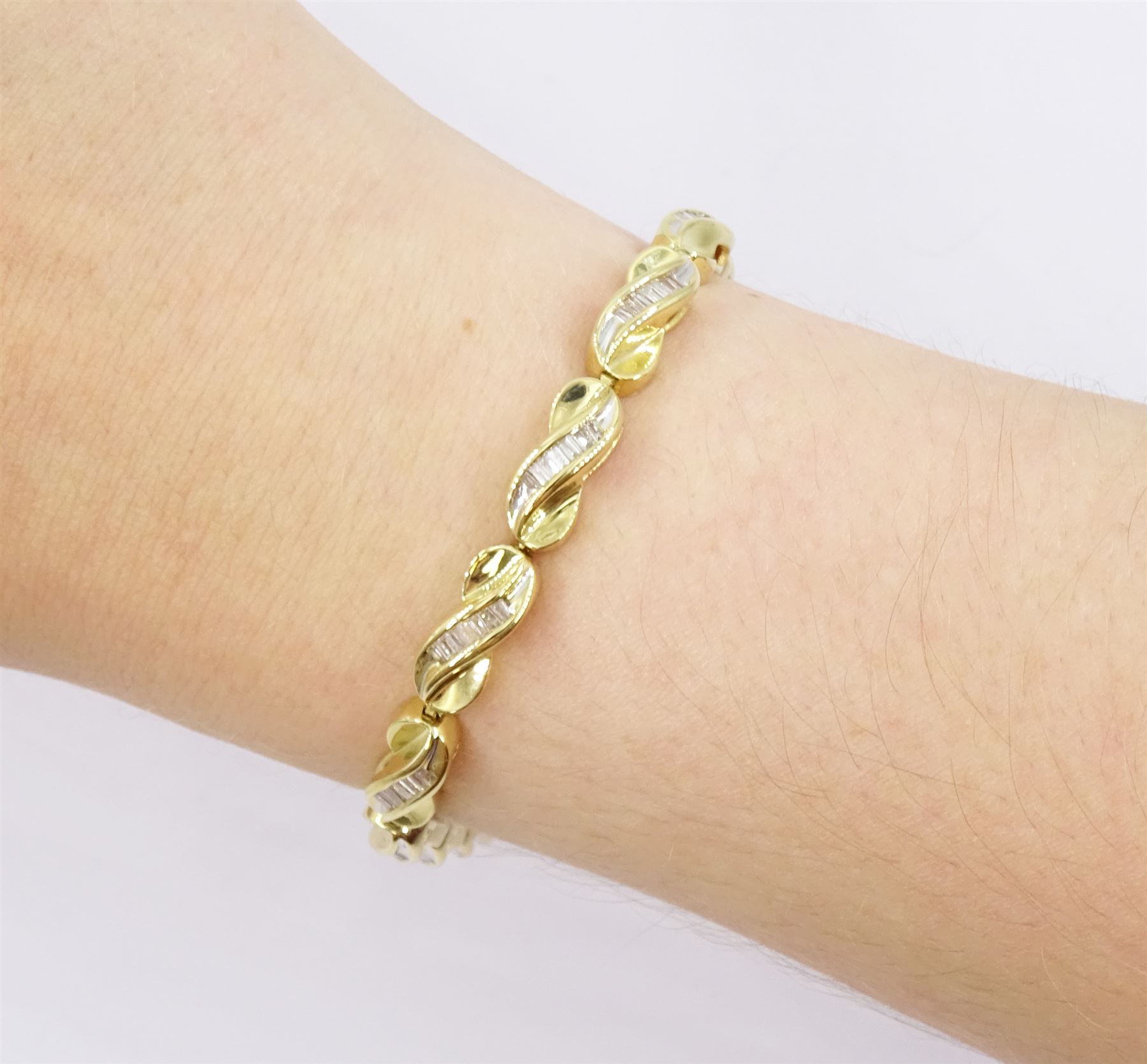 14ct gold baguette cut diamond, infinity link bracelet