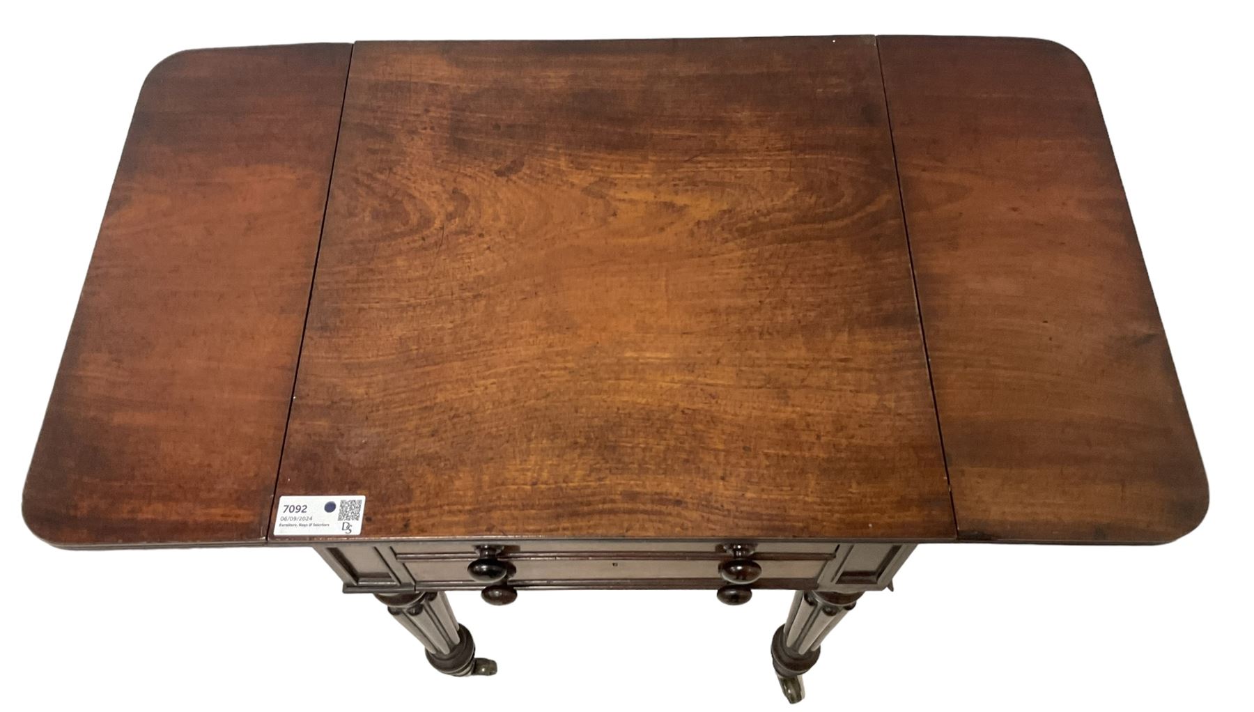 19th century mahogany drop-leaf work table, rectangular top with rounded corners, fitted with two cock-beaded drawers over pleated silk storage well, with matching opposing faux drawers, on turned and lobe moulded supports on castors