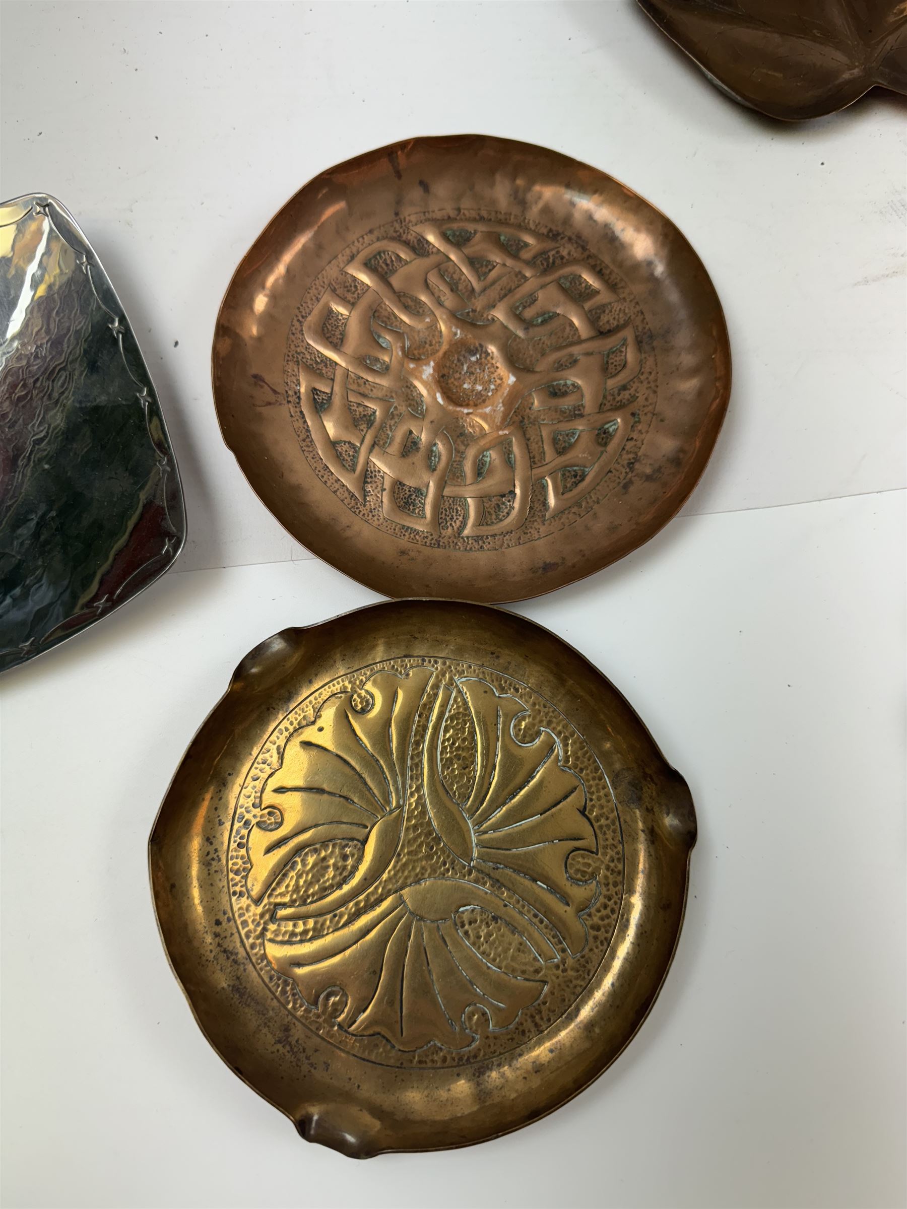 Keswick School of Industrial Arts, flared vase of cylindrical form, together with an Arts and Crafts plated copper, an embossed tray, copper dishes and charger 