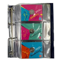 The Royal Mint United Kingdom 'London 2012 sport collection' comprising twenty-nine commemorative 2011 fifty pence coins, including 'Aquatics', 'Archery', 'Athletics', 'Badminton', 'Basketball' etc, all on official card, housed in a Change Checker ring binder 