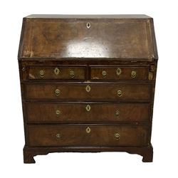 18th century walnut bureau, crossbanded and feather-banded rectangular top and fall-front, enclosing fitted interior with pigeonholes and correspondence drawers with bone handles, over two short and three long graduating drawers with moulded facias and original brass handles, on bracket feet