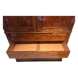 Victorian mahogany linen-press, moulded cornice over two figured panelled doors, the interior fitted with five slides and hanging rail, four long drawers below 