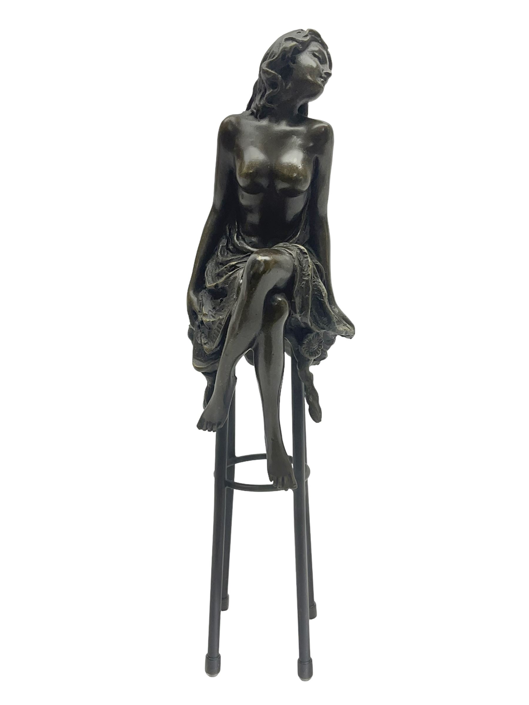 Art Deco style bronze modelled as a semi naked female figure, seated upon a chair, after 'Pierre Collinet', H27cm