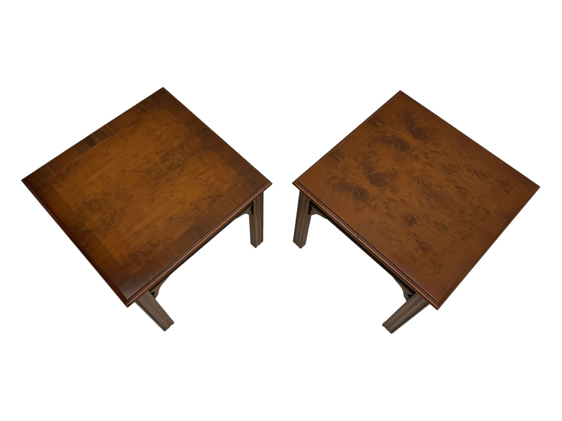 20th century pair of yew wood lamp tables, moulded square top with pierced corner brackets, on fluted straight supports 