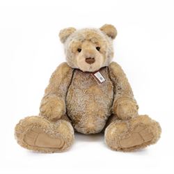 Charlie Bears large plush jointed teddy bear 'Ian', with light brown fur and brown bow, de...