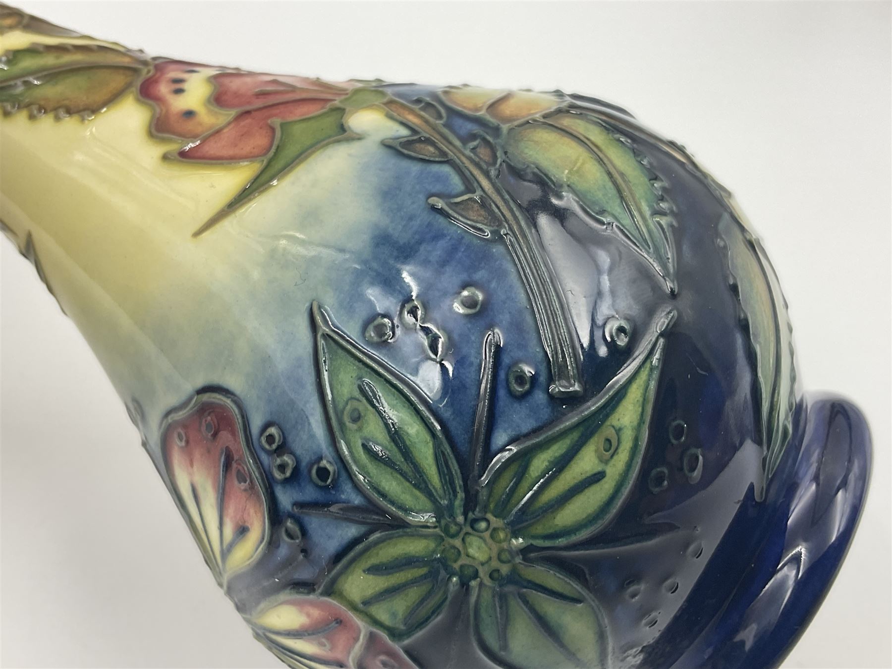 Moorcroft vase, of bottle form, decorated in the Sweet Briar pattern by Rachel Bishop, dated 1997, H7cm, together with a Moorcroft pin dish decorated in the Anna Lily pattern, D12cm (2)