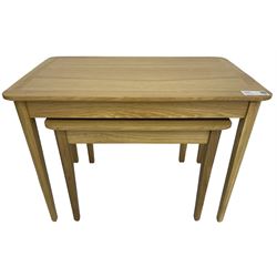 Contemporary light oak nest of two tables, rectangular top over tapering supports