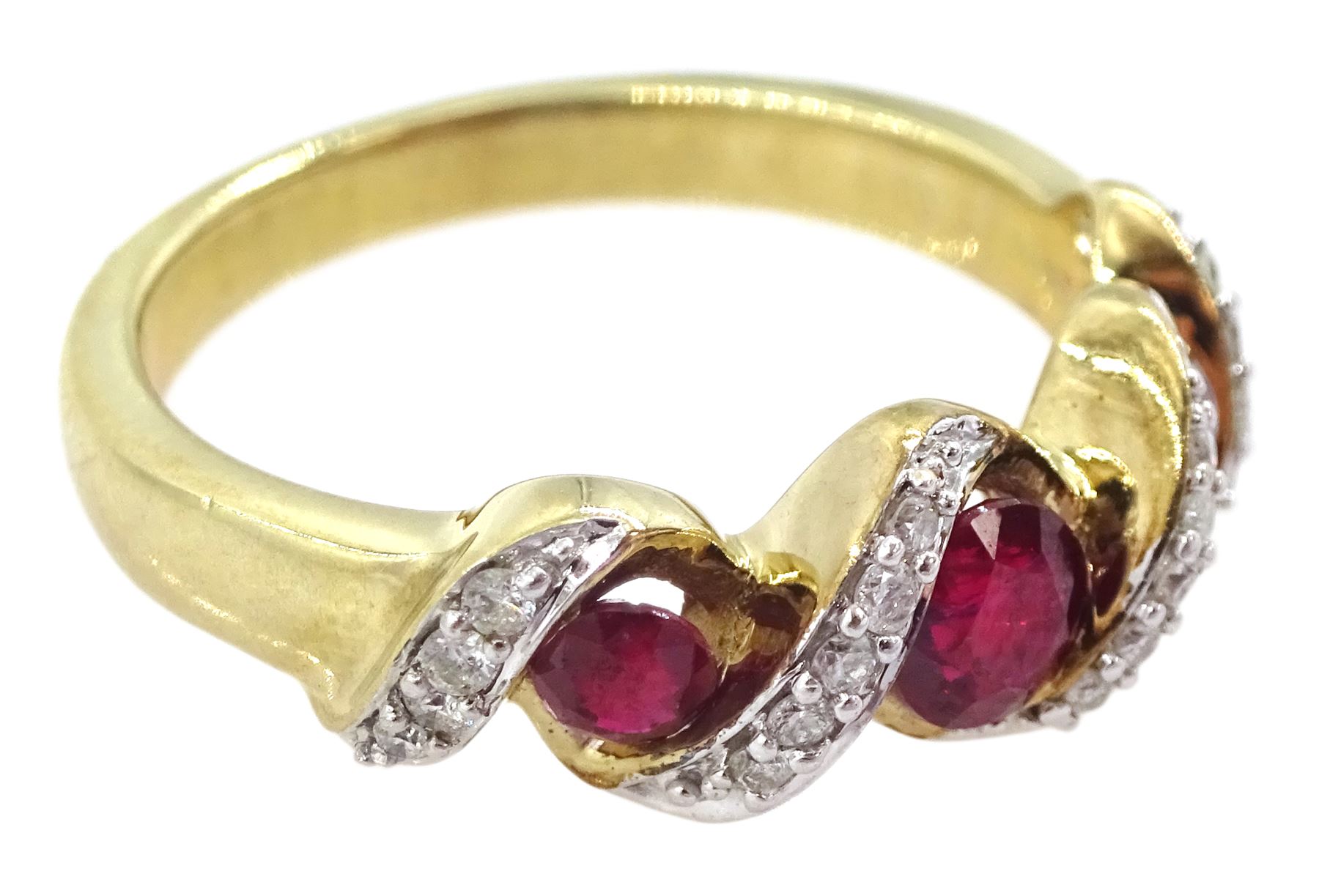 9ct gold three stone ruby and diamond crossover ring, hallmarked