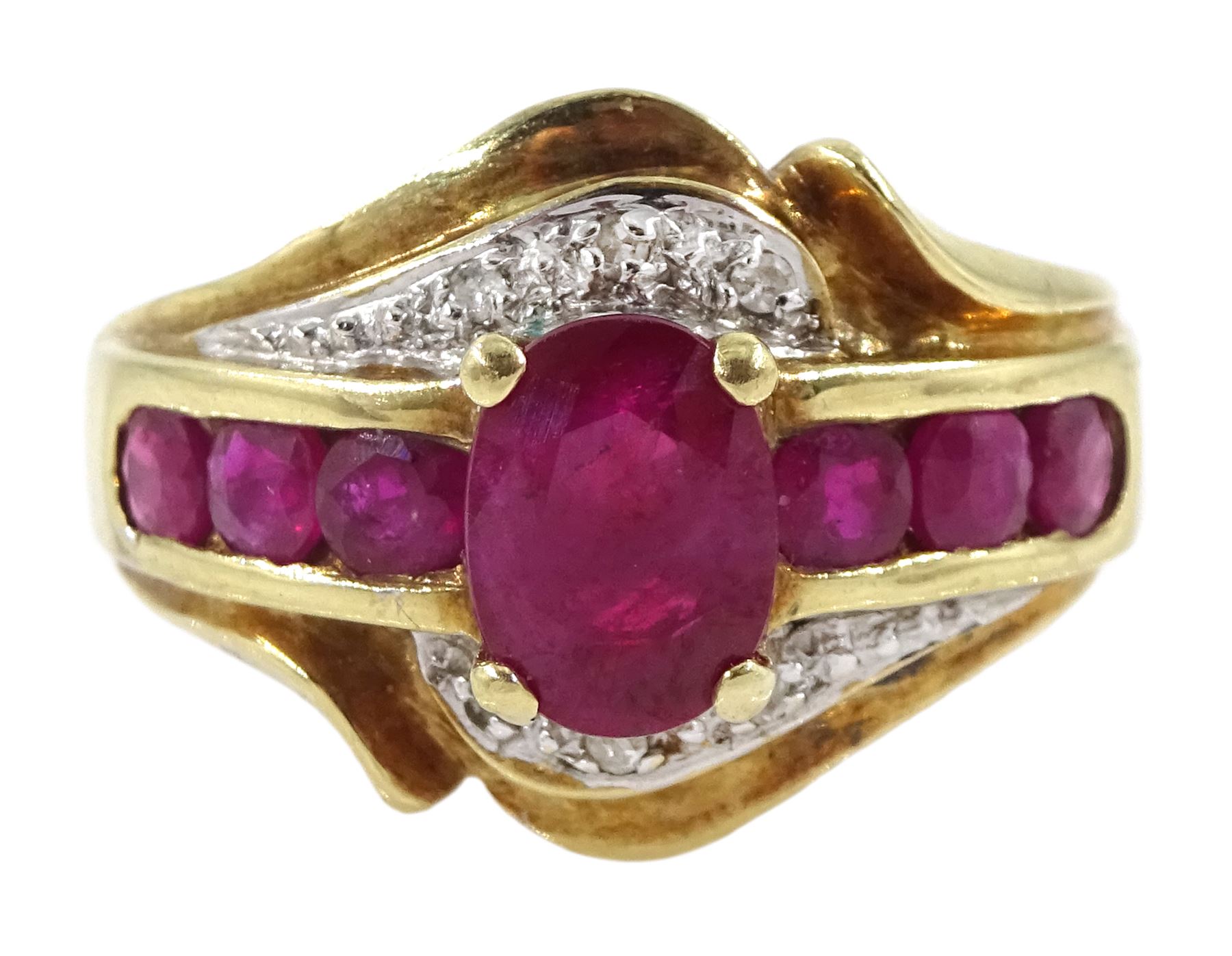 Gold ruby and diamond cluster ring, stamped 10K