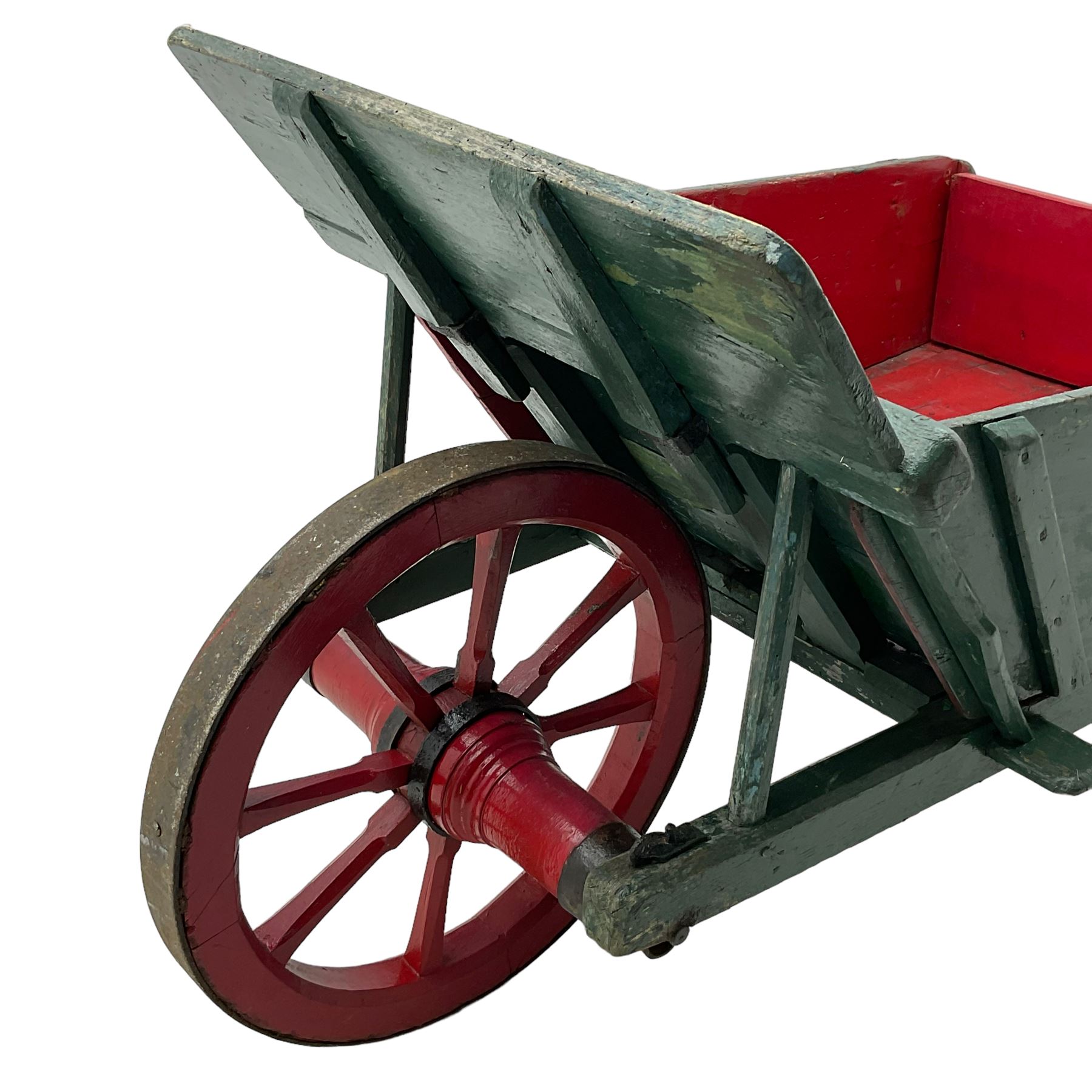 19th century green and red painted wooden wheelbarrow, flat bed with removable sides and back, wooden and wrought metal strap wheel 