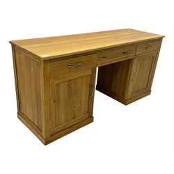 Contemporary light oak twin pedestal desk, fitted with three drawers over two cupboards with chrome handles, the central drawer with hinged front panel revealing pull-out keyboard tray, on plinth base