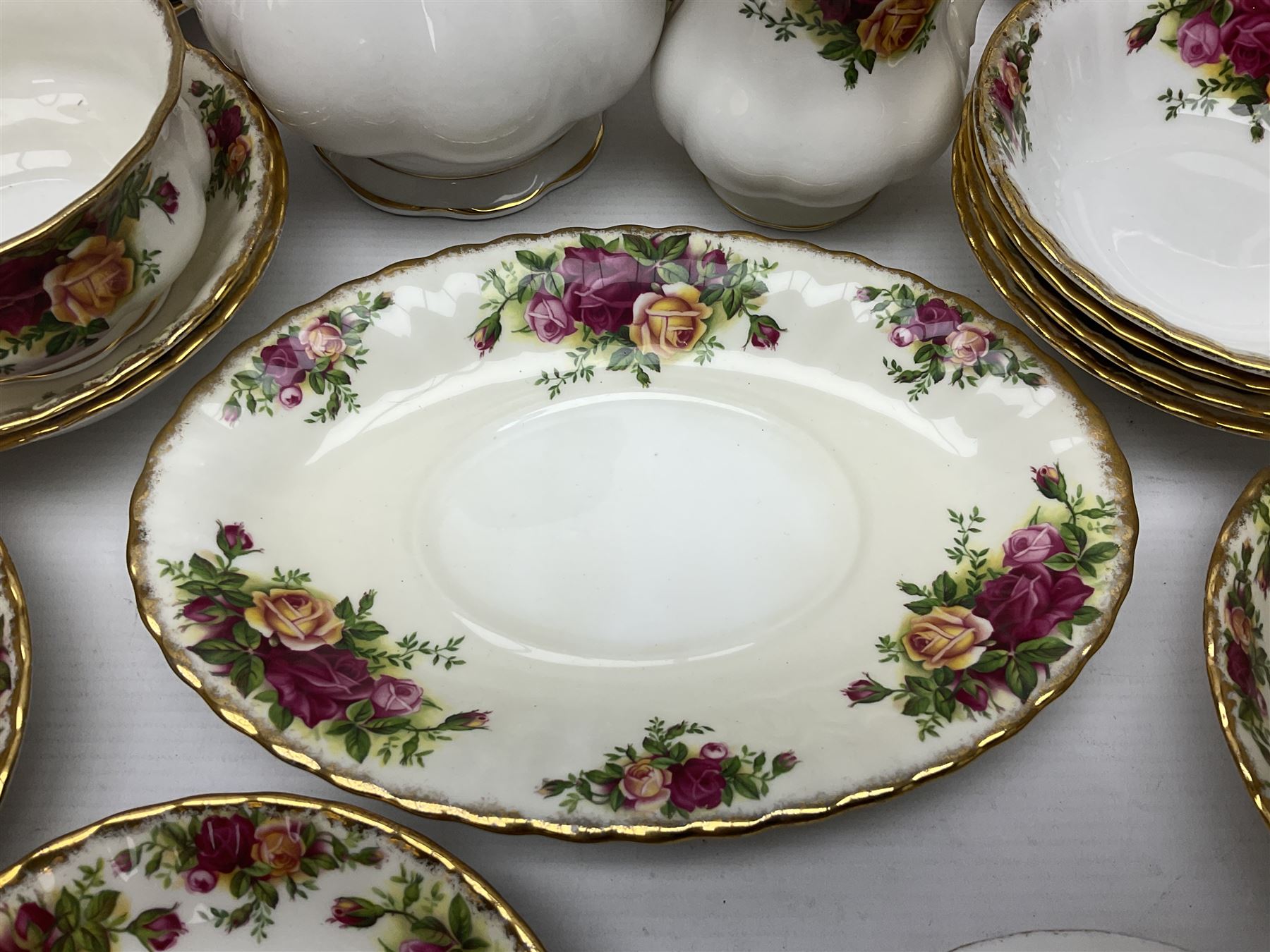 Royal Albert Old Country Roses pattern coffee set for four, comprising coffee pot, milk jug, cups and saucers, cake plate, together with six dinner plates, side plates etc (34) 